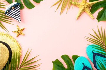 Fototapeta na wymiar Summer flat lay background. Palm leaves, sea shells and accessories on pink.
