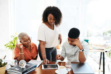 The key to success lies in the collaborative efforts of all. a group of businesspeople working together on a digital tablet in an office.