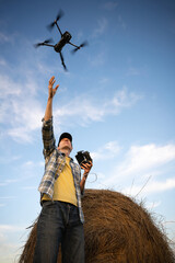 Farmer controls drone. Smart farming and precision agriculture
