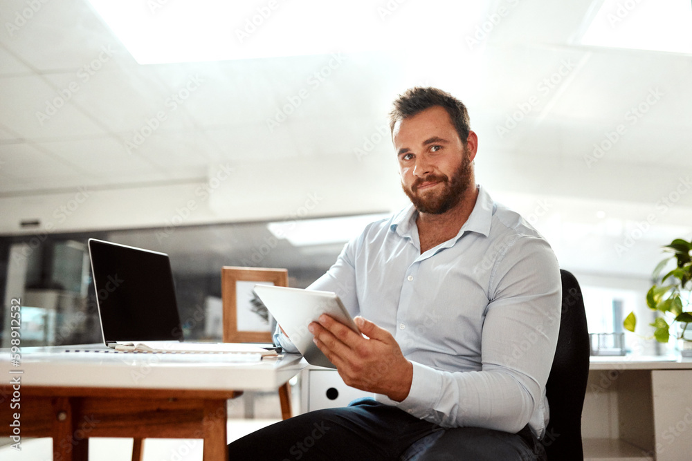 Poster working with apps is just smarter for my business. portrait of a young businessman using a digital t