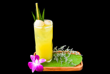 Lychee juice with slice of lychee fruit, with flowers isolated on black background