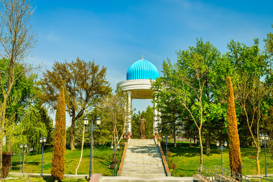 Uzbekistan, Tashkent - April 24, 2023: Monument to the Uzbek poet Alisher Navoi under the dome in the park of poets in Tashkent during the daytime against the blue sky in spring.
