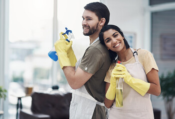 Dont just bust germs, bust gender stereotypes. a happy young couple getting ready to disinfectant...