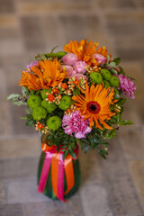Bouquet with gerberas and other flowers in a vase