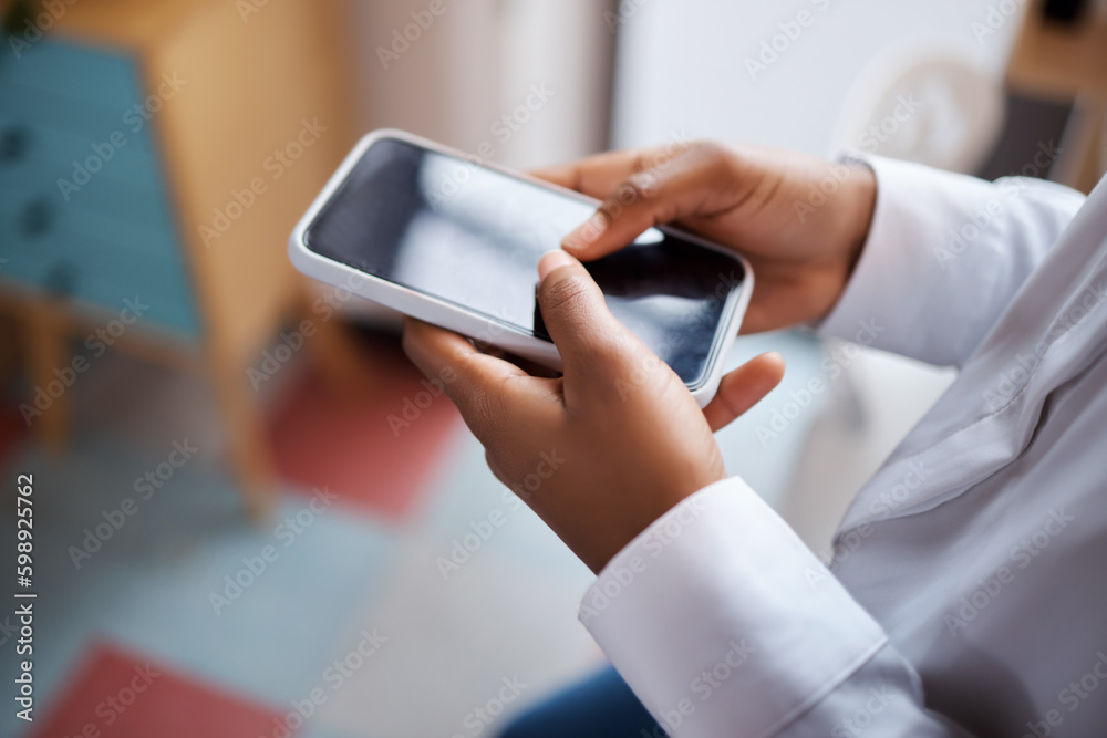 Poster keeping connected even when were oceans apart. an unrecognisable businesswoman using a smartphone in