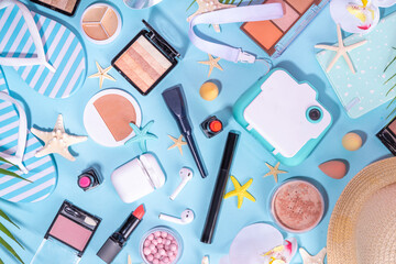 Summer make-up cosmetics flat lay, Vacation, Holiday shopping sale make up.Shadows, lipstick, mascara, face powder, blush, with summer accessories, starfish, shells