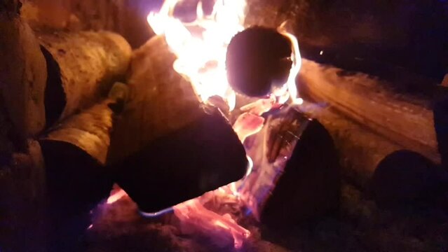 Burning firewood in fireplace. 