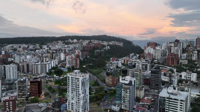 Aerial drone view of a small upscale neighborhood with apartments in Quito, Ecuador at dusk