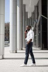 young african businessman calling on the phone