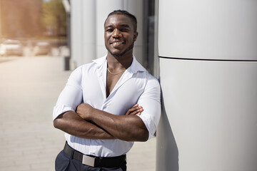 Obraz premium portrait of happy african man near building