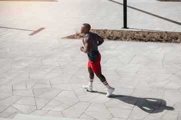 african runner in sportswear in the city	
