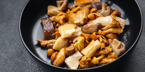mushroom salad mix white mushroom, boletus mushroom, chanterelle mushroom, ready to eat meal food snack on the table copy space food background rustic top view