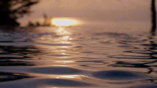 Sunlight Reflecting On The Water Of The Infinity Pool