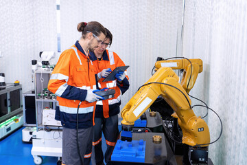 Engineer service robot welding in factory software programming operation test and commissioning