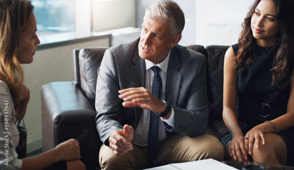 Poster put your ideas out there. a group of businesspeople having a discussion while sitting together on a 