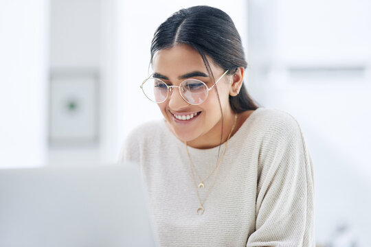 Work Your Way Towards Great Results. A Young Businesswoman Working On A Laptop In An Office.