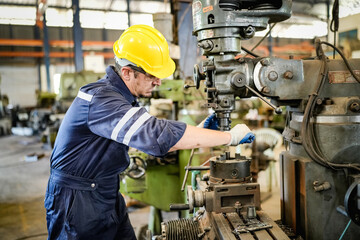 Lathe Operators Concentrated on Work. Worker in uniform and helmet works on lathe, factory....