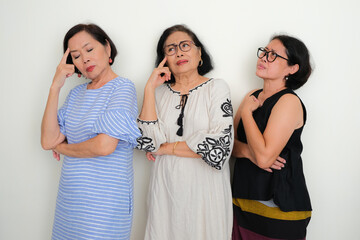 Three women lined up with bored and sad expression