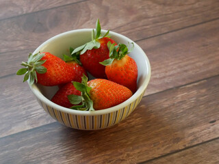 strawberries in a snack bowl, healthy eating concept close up