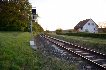 Fototapeta premium In the future, the railway tracks run between the forest and the house