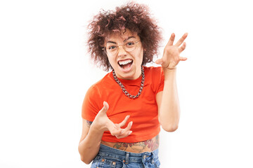 Portrait of young funny caucasian curly girl with tattoo grimaces, posing. Young woman joking and dancing isolated on white studio background