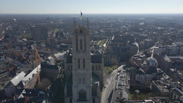 High aerial approach to St. Bavo's Cathedral in Ghent Belgium