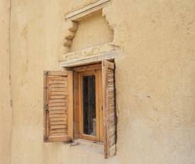 Old wooden window in egyptian mud brick house