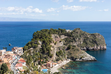 Rocky peninsula with deep, blue sea on Sicily coast