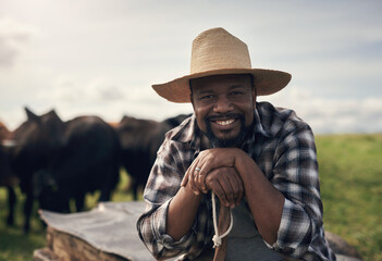 My cows were grass fed before it was cool. a mature man working on a cow farm.