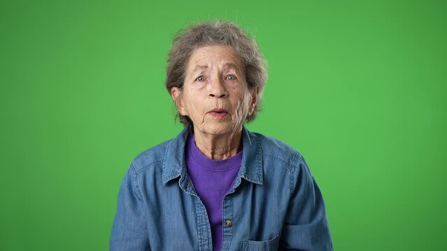 Portrait of tired, sleepy elderly senior old woman hold hands folded in prayer begging about something making wish keep fingers crossed isolated on green screen background studio. Generative AI