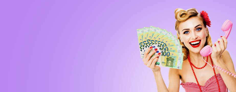 Happy smiling woman with fan money cash, talking on phone, dressed in pin up style, light purple violet background. Blond girl in retro fashion vintage concept. Wide banner composition image.