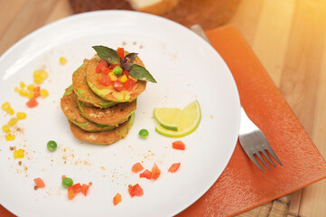Vegetable zucchini fritters served on a plate