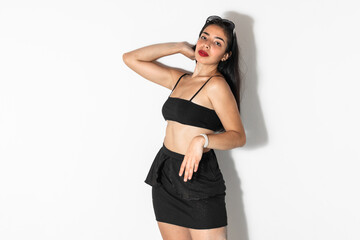 Fototapeta premium portrait of beautiful brown-skinned latina woman posing and looking straight ahead, on a white background