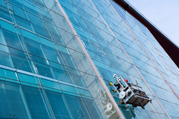 Window washers in a high office building.
