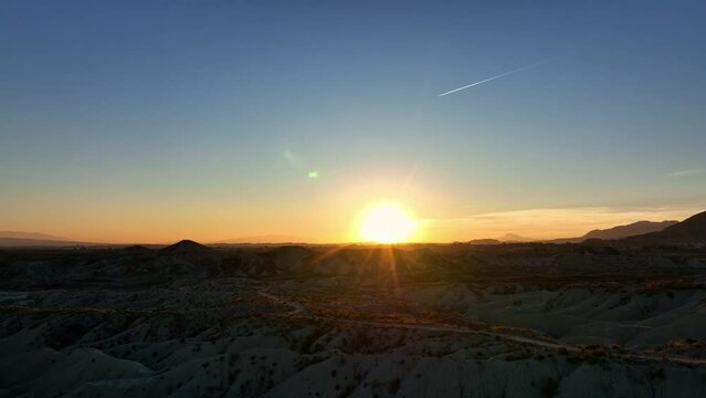 Picturesque view of sunset over dry badlands