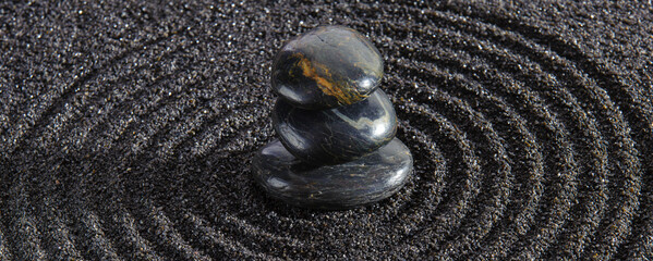 Japanese Zen garden with stone in textured sand