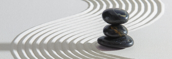 Japanese Zen garden with stone in textured sand