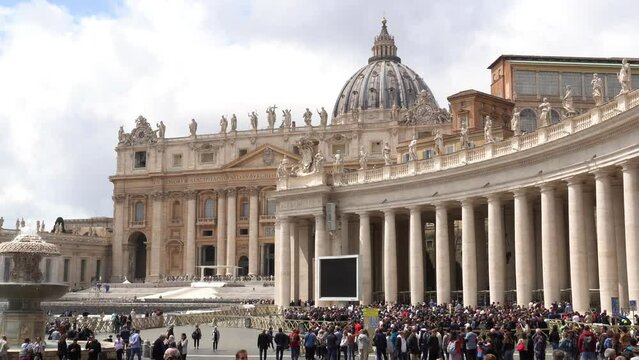 Europe, Italy, Rome 2023 - tourists and Catholic Christian faithful visit St. Peter's Square, seat of the Vatican and the residence of Pope Francis - tourist attraction and sightseeing 