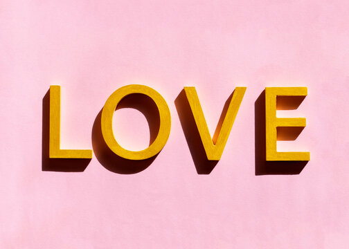Love letters on pastel pink background