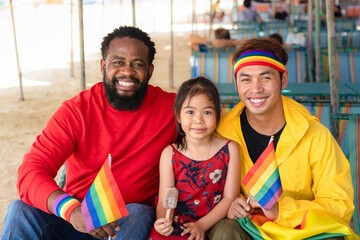 gay couple family and adopted children have wonderful time together smiling for sexual freedom and...