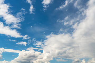Naklejka na ściany i meble Beautiful fluffy clouds on the blue sky. Sky clouds background.