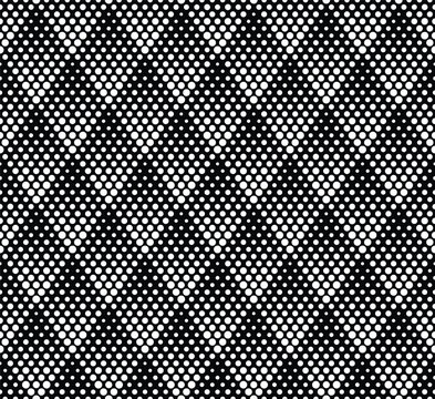 Abstract geometric pattern of dotted rhombuses. Vintage geometric textile texture. Monochrome halftone style with white dots on a black background. Seamless vector graphic illustration.