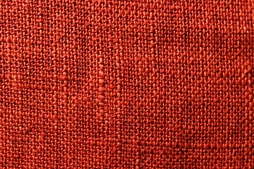 Old style red or orange textile. Denim design background. Industry red fabric beautiful. Texture original textile pattern. cushion clothing. Great vintage fabric material. Red textile macro.