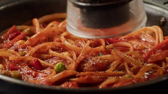 Chef cooking tomato Italian bolognese fresh pasta with tomato sause, man making traditional italian dinner on restaurant kitchen, tasty food Generative AI