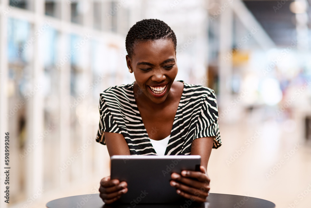 Aufkleber im finding so much inspo on the net. a young businesswoman using a digital tablet in an office.