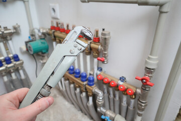 Plumber at work, plumbing repair service, assemble and install concept. Plumber fixing central heating system