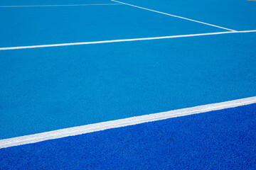 Sport field court background. Blue rubberized and granulated ground surface with white lines on ground. Top view
