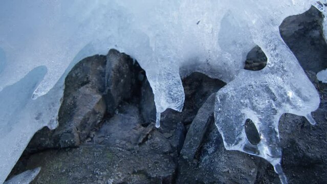 Macro shot of a stalactic frozen on rock, in the Alps, Switzerland