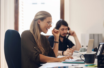 Fototapeta premium Tenacitynbspis driven by your determination to achieve a goal. a young businesswoman looking excited while working on a laptop in an office.