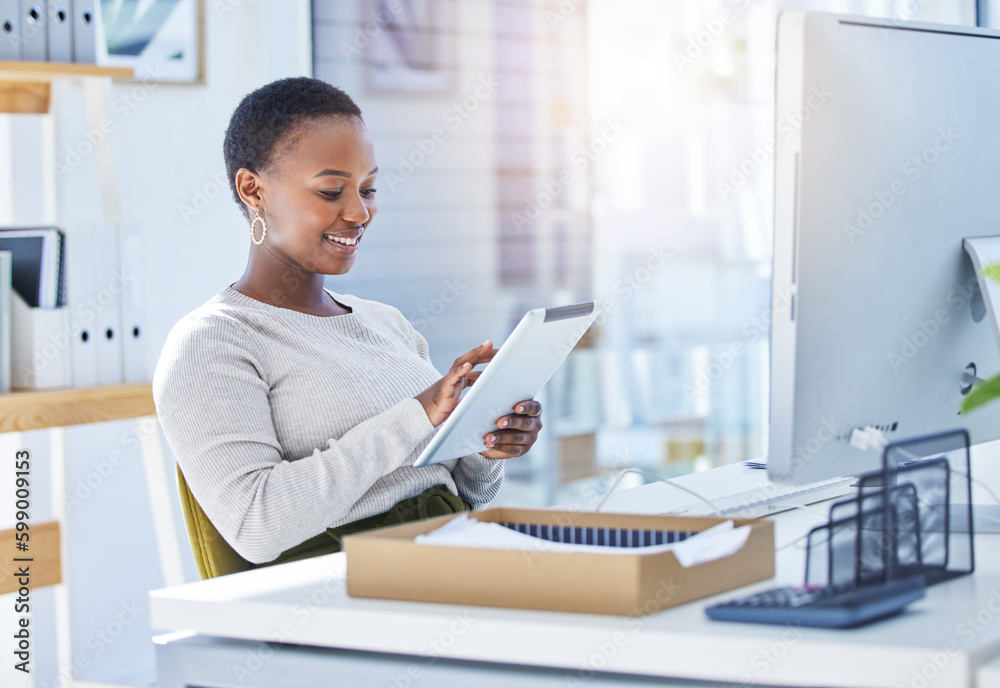 Canvas Prints Taking the time to learn and test out different marketing hacks. a businesswoman using a digital tablet while sitting at her desk.